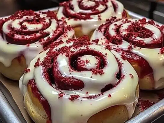 These Red Velvet Cinnamon Rolls are soft, fluffy, and topped with creamy frosting. A delicious twist on a classic cinnamon roll!