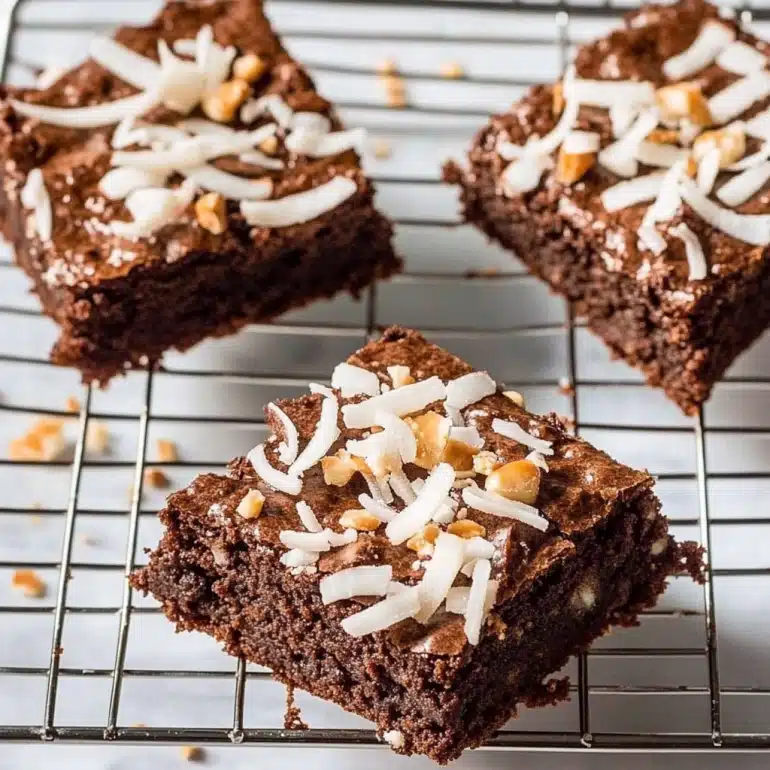 These Coconut Brownies are rich, chewy, and topped with sweet coconut &ndash; an easy dessert you&rsquo;ll bake again and again.